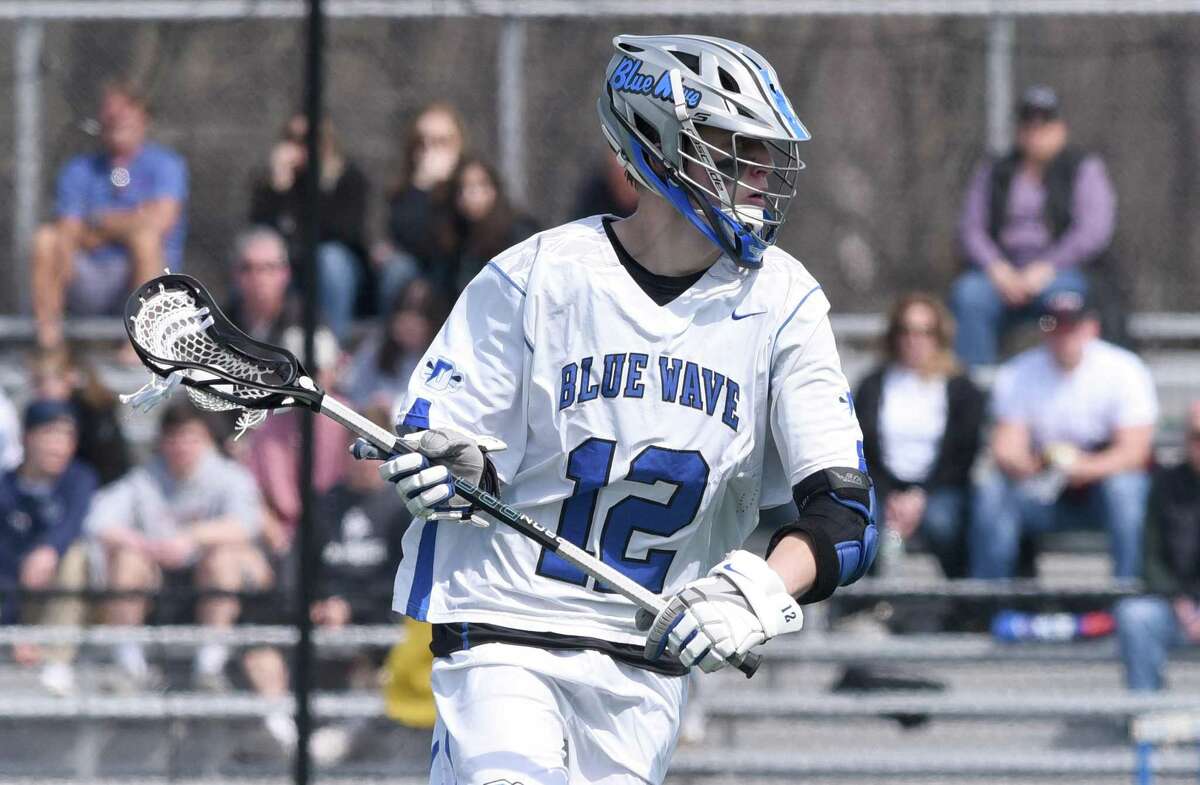 Darien senior co-captain Tommy Hellman in action during the Blue Wave’s boys lacrosse game against Yorktown (NY) at Darien High School on March 30, 2019.