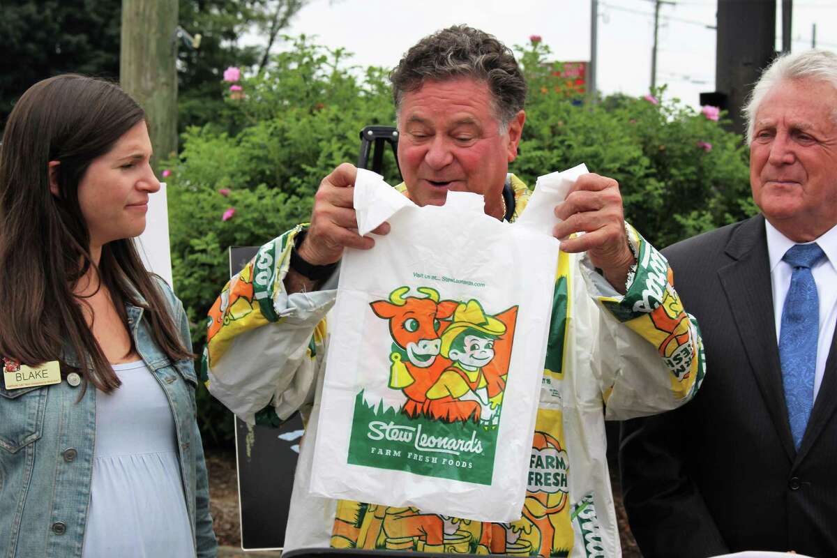 Stew Leonard Jr., the president and CEO of Stew Leonard's, his daughter Blake and Norwalk Mayor Harry Rilling said goodbye to single-use plastic bags at an event on Monday, July 8, 2019, the first day plastic bags were officially banned in Norwalk.