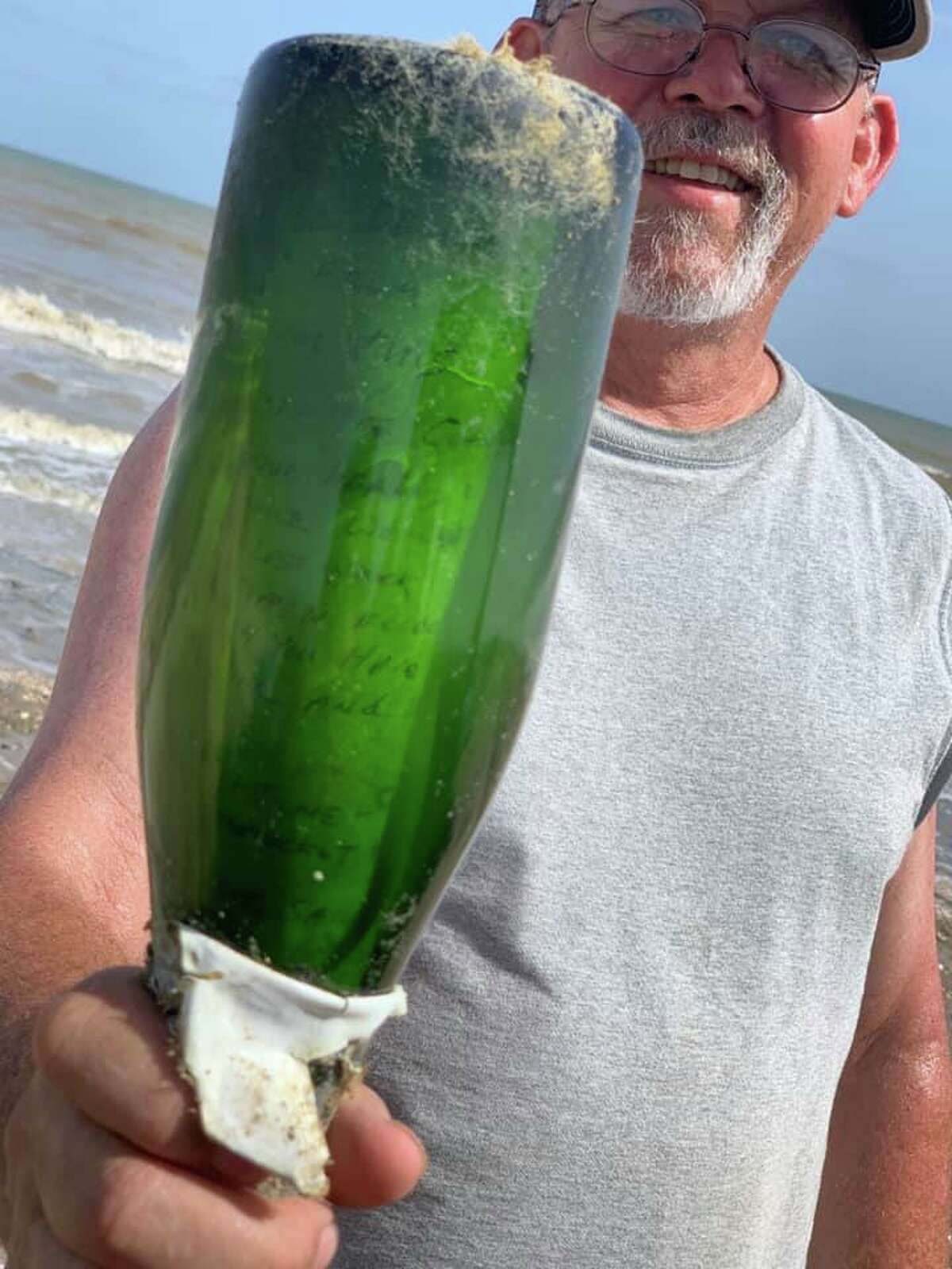 James Howie Hill says on Friday, the group had been combing for several hours. That's when he spotted a green object that caught his eye. "I saw the bottle and it looked like it had something in it," said Hill. "After wiping the dried algae off I saw the note and handwriting. We were all excited."