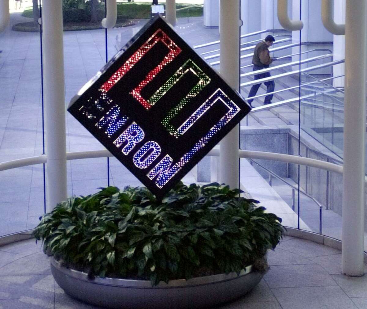 A revolving Enron Corp. logo seen in the lobby of the energy company’s Houston headquarters in 2002