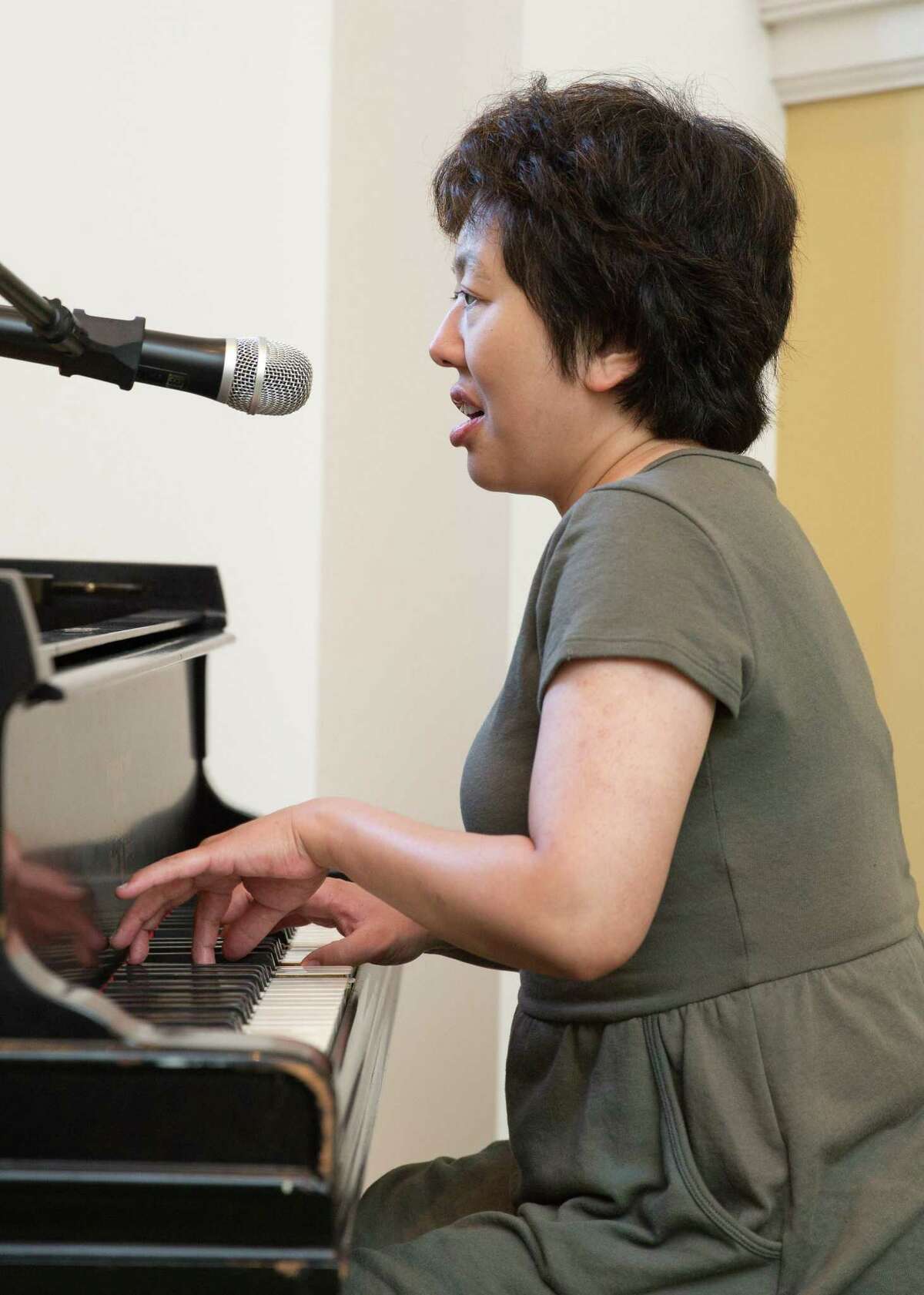 Misa Shimada, an Abilis participant of 20 years, plays the piano.