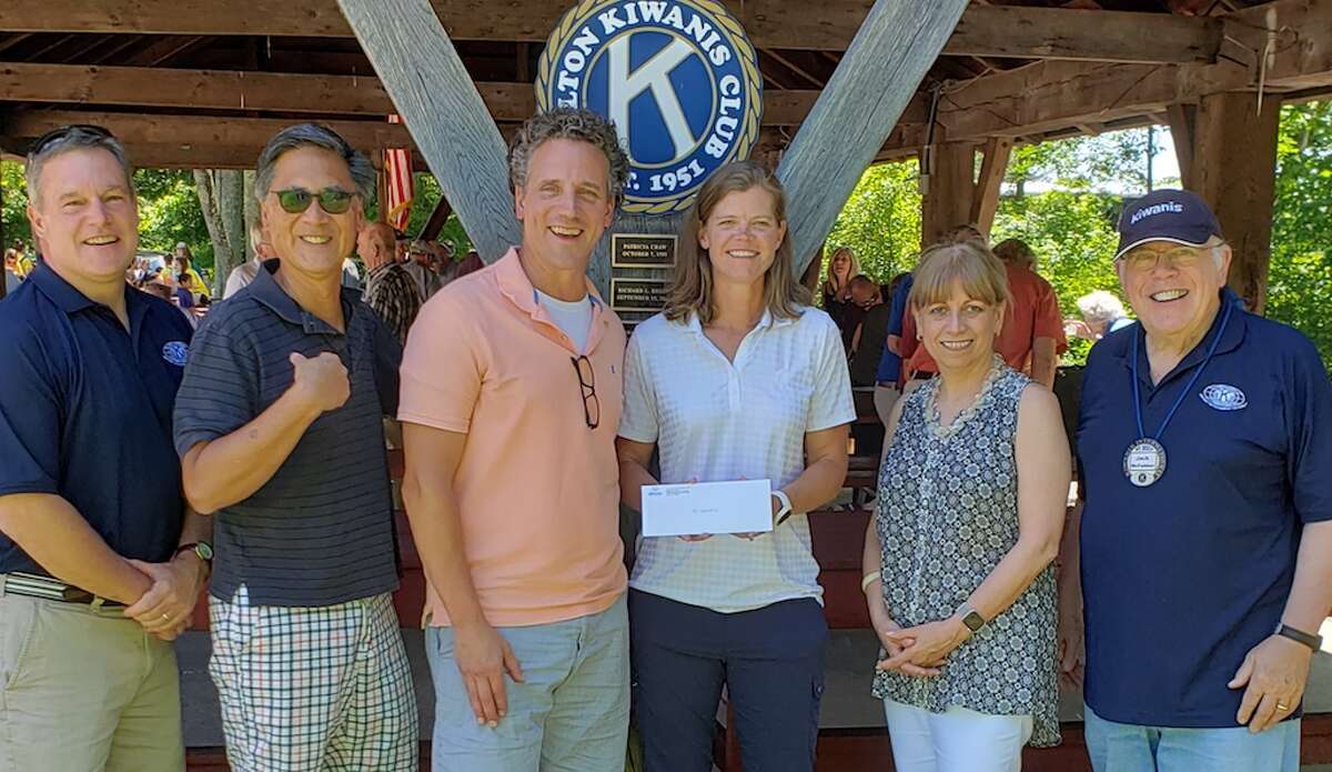 At the check presentation are, from left, Kiwanis member Jeff Turner; Kiwanis Vice President Greg Chann; John Priest, director of programing at Trackside; Cindy Moser ,Trackside director of development and operations, Mary Anne Franco, Kiwanis vice president; and Kiwanis president Jack McFadden.