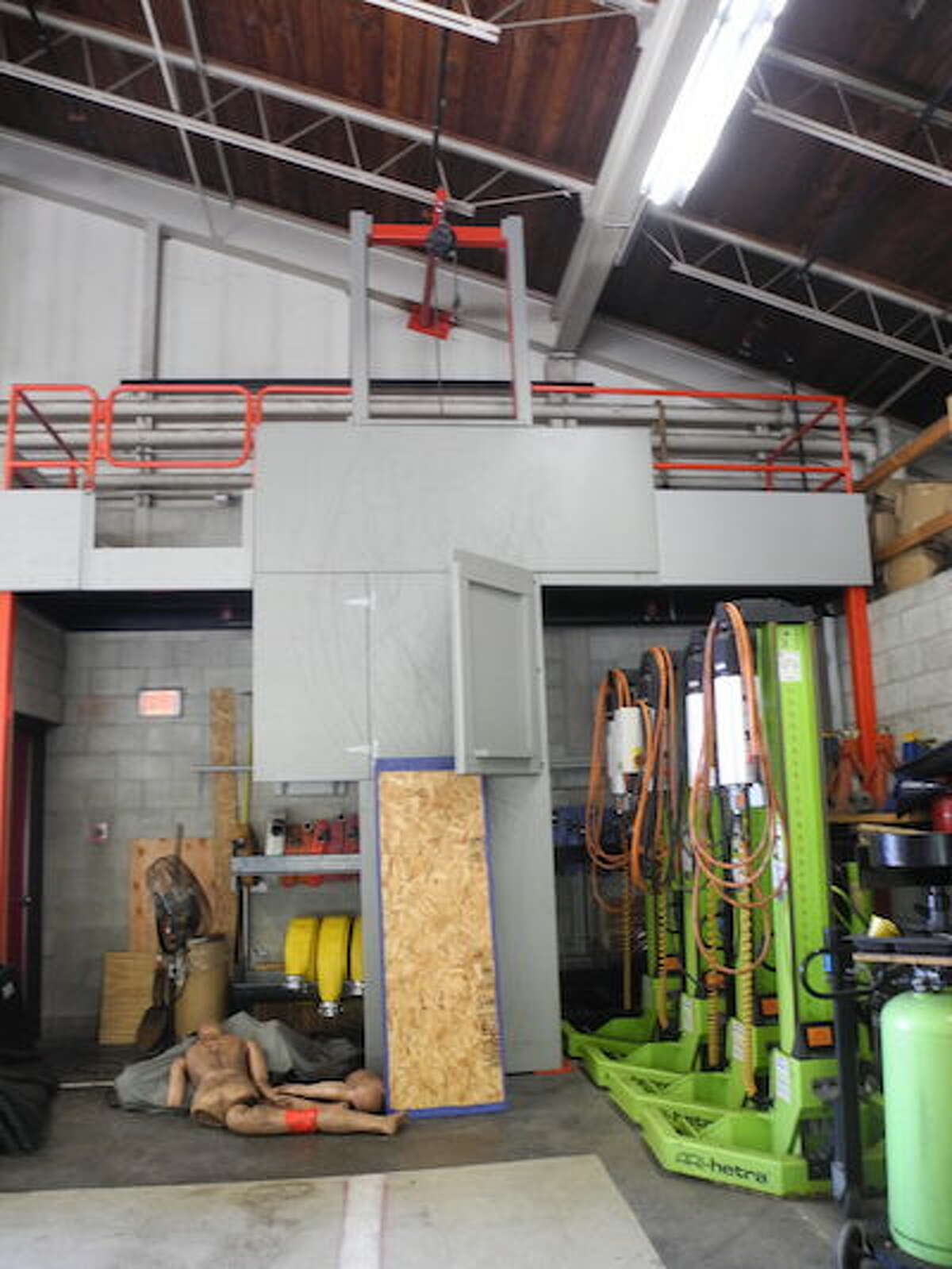 An indoor rescue facade enables firefighters to practice self-rescue and rescuing a person out a window. —Jeannette Ross/Hearst Connecticut Media