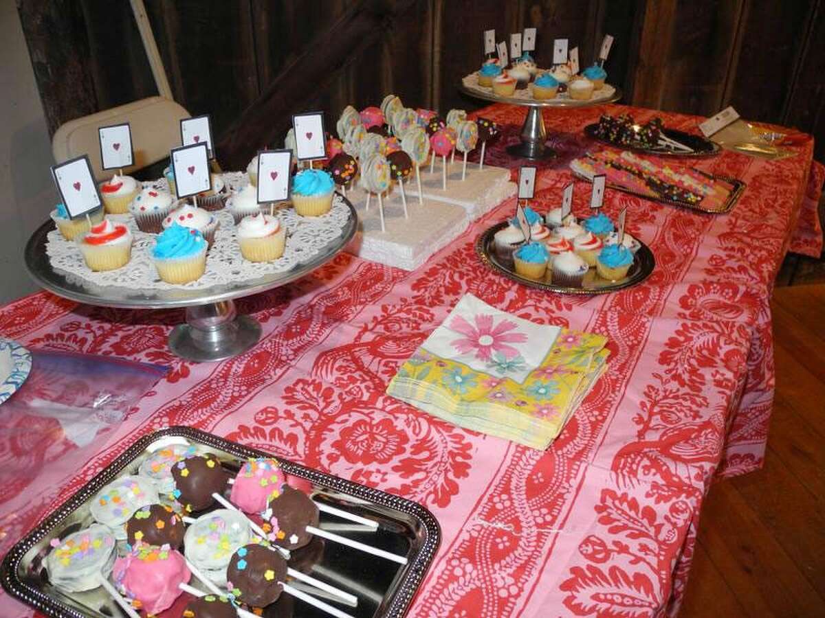 An array of goodies, including cakes and candies, awaited guests at the Wilton Historical Society’s Mad Hatter Tea Party. — Contributed photo