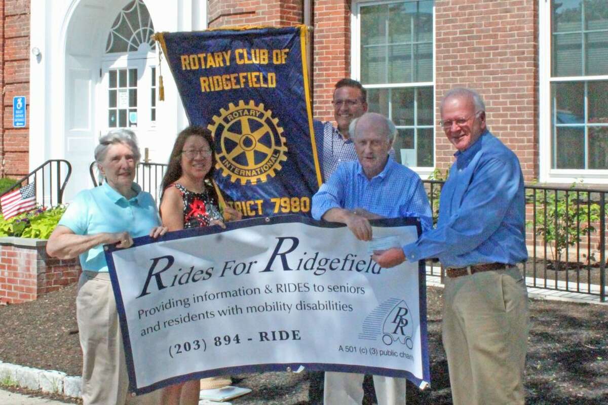 From left to right: Margaret Thompson, Nancy Brandon, David Yagnesak and Dave Smith of Rides for Ridgefield presented donation by Joe Cleary of the Rotary Club of Ridgefield.