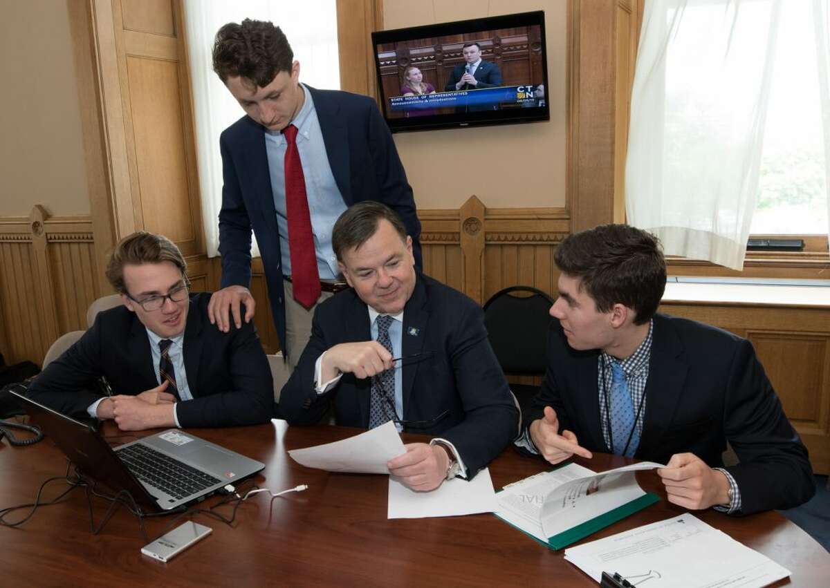 Ridgefield residents Chris Flynn, Miles Tullo, and Alec Pool with State. Rep. John Frey. Petros Papadopoulos and  Nicholas Patterson also worked as interns for Frey on a research project stretching back to 1776.