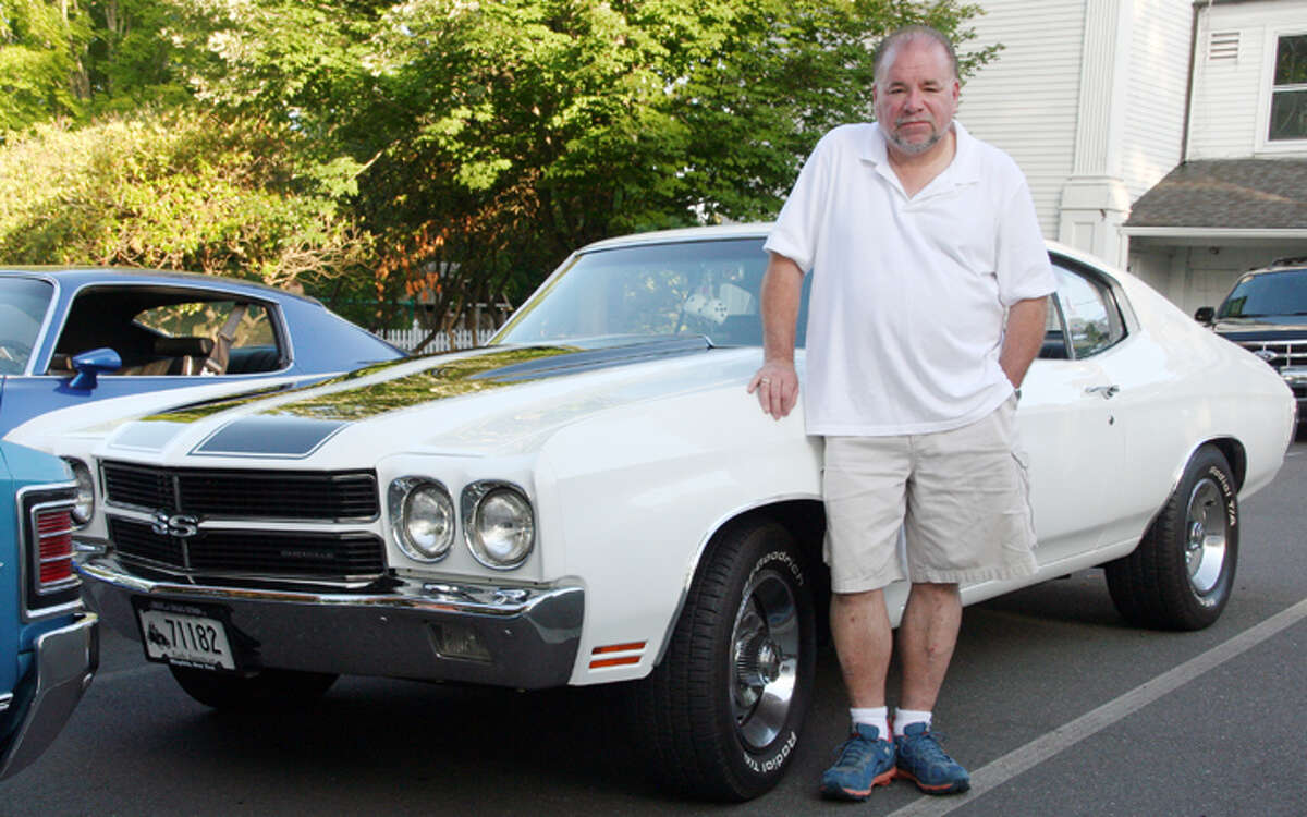 Memory Lane Cruisers member David Coles with his 1970 Chevrolet Chevelle. -Nicholas Martinez photo