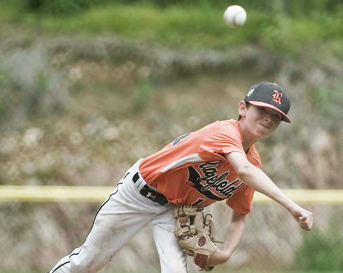 Chris Keating throws a pitch in Ridgefield's District 1 tournament game against Wilton. - Scott Mullin photo
