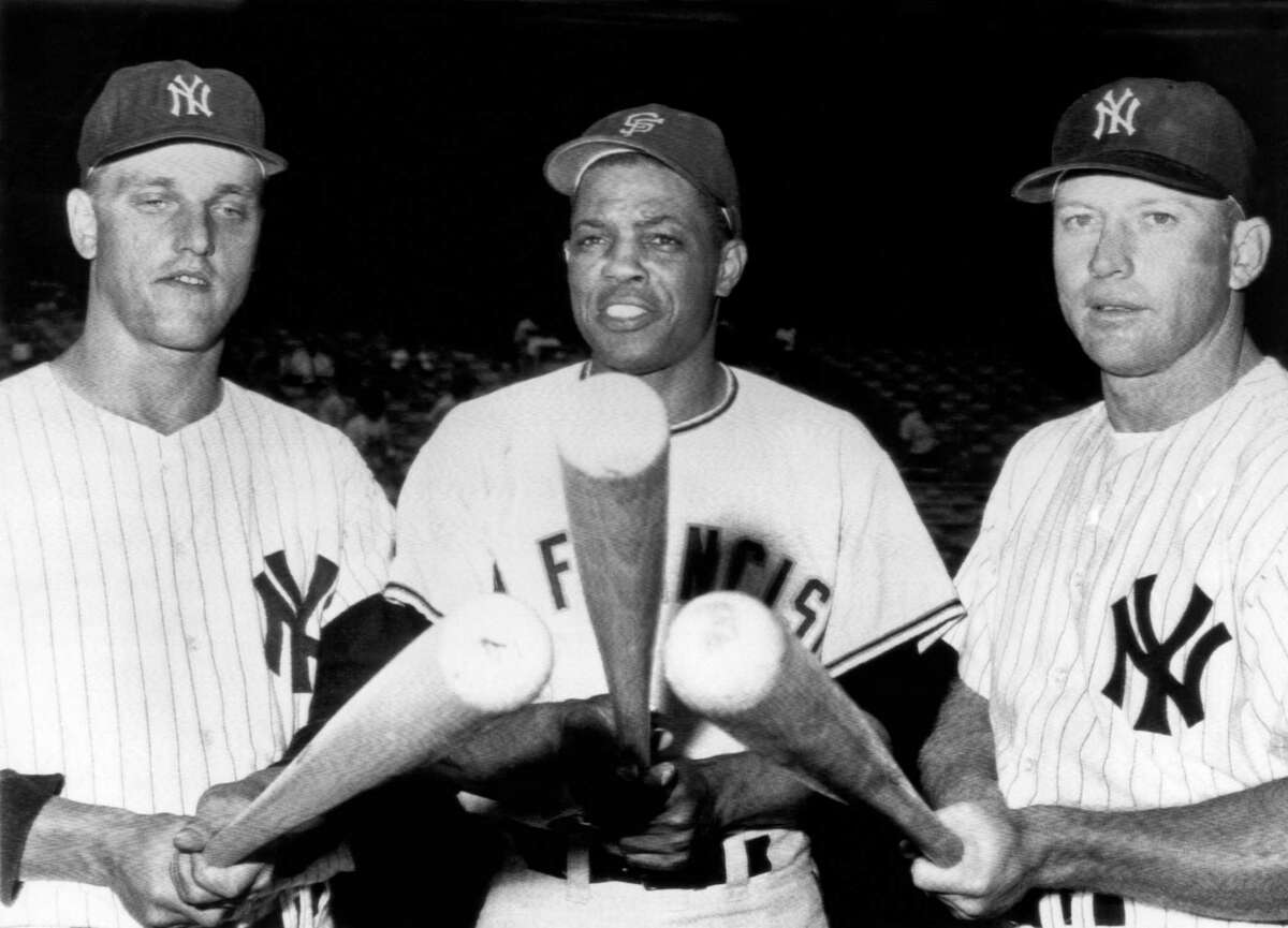 Slugging outfielders before an exhibition game at Yankee Stadium. L-R, Roger Maris, Yankees, Willie Mays, Giants, and Mickey Mantle, Yankees. New York, New York, July 24, 1961. (Photo by Underwood Archives/Getty Images)