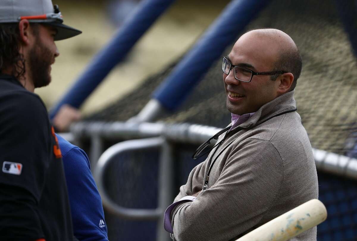 LOS ANGELES, CALIFORNIA - APRIL 03: Farhan Zaidi (R), former Los Angeles Dodgers General Manager and current President of Baseball Operations for the San Francisco Giants, and Brandon Crawford #35 of the San Francisco Giants look on during batting practic