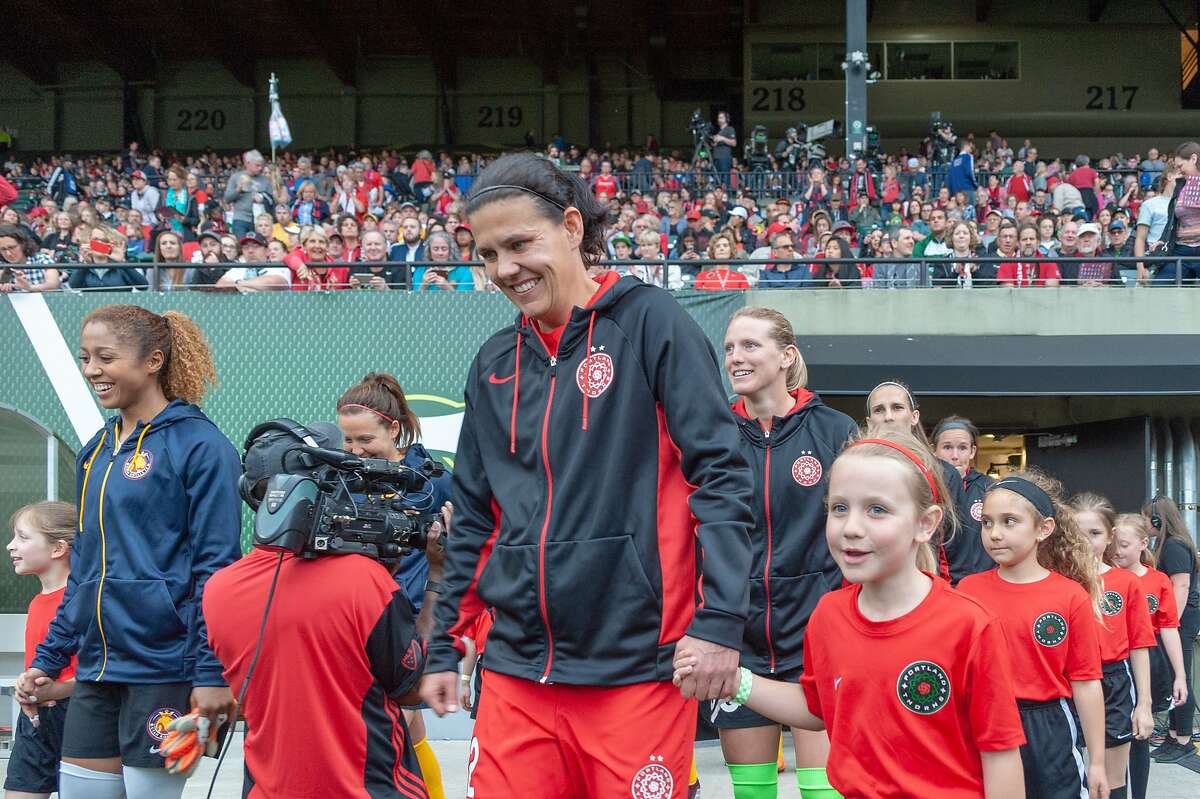 PORTLAND, OR - MAY 25: Portland Thorns forward Christine Sinclair and Utah Royals midfielder Desiree Scott lead their teams to the pitch moments before the Portland Thorns 2-0 victory over the Utah Royals on May 25, 2018, at Providence Park, Portland, OR. (Photo by Diego Diaz/Icon Sportswire via Getty Images)