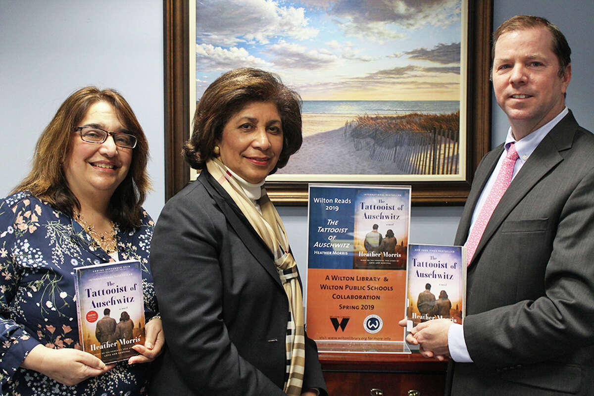 Fran Kompar, the school district's digital learning director, left, Wilton Library Executive Director Elaine Tai-Lauria, and Superintendent of Schools Kevin Smith at the rollout of the Wilton Reads program.