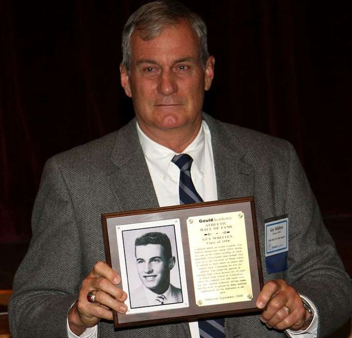 Former Wilton High boys lacrosse coach Guy Whitten is among seven inductees in the Fairfield County Sports Hall of Fame's 2019 class. Whitten is shown with a plaque he received after being enshrined in the University of Maine's Gould Academy Athletic Hall of Fame.