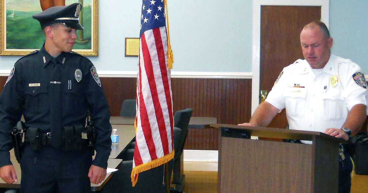 Danbury officer Alex Relyea shot 31-year-old Aaron Bouffard in July and 45-year-old Paul Arbitelle in December. In this file photo, Relyea is addressed by Chief Shawn Boyne moments after being sworn in to serve in the New Milford Police Department during a July 11, 2012 ceremony in the E. Paul Martin Meeting Room at New Milford Town Hall. Courtesy of the New Milford Police Department