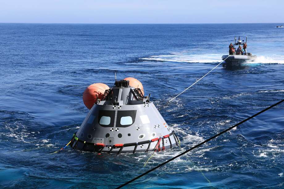 The test version of the Orion capsule is set to be released into the open water as part of Underway Recovery Test-7, aboard the USS. John P. Murtha, on Nov. 1, 2018. During recovery operations, future astronauts aboard Orion will have the choice to stay in the capsule while it is pulled into the well deck of a U.S. Navy ship, or be pulled out immediately and put on the "front porch" until taken by small boat back to the ship. URT-7 is one in a series of tests to verify and validate procedures and hardware that will be used to recover the Orion spacecraft after it splashes down in the Pacific Ocean following deep space exploration missions. Orion will have emergency abort capability, sustain the crew during space travel and provide safe re-entry from deep space return velocities. (Kim Shiflett/NASA)