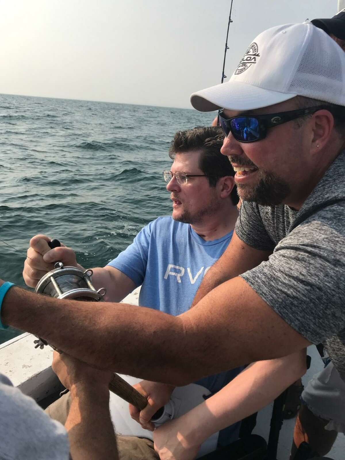 Mark Smolen, left, and longtime friend Dan Beyer enjoy some deep sea fishing, thanks to a trip donated by Capt. Mike Stepski of the Tartan II of Niantic.