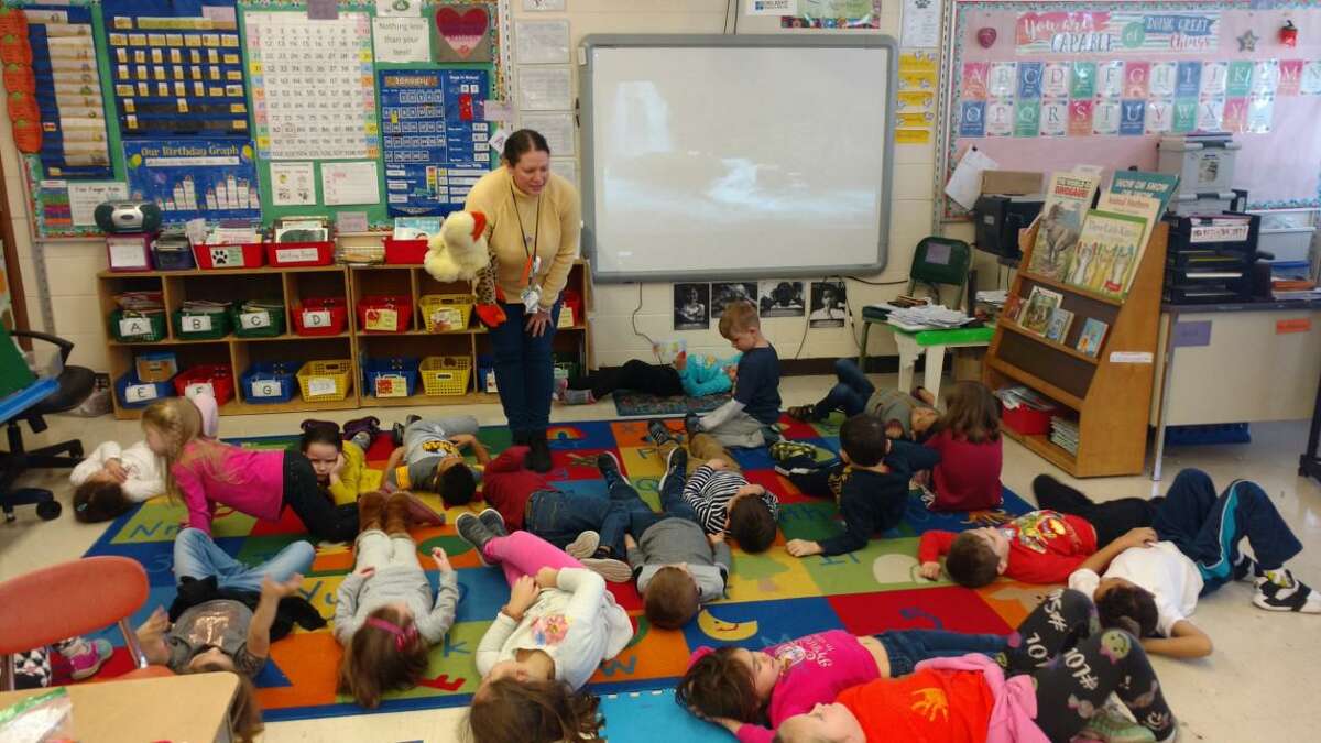 Booth Hill School kindergarten teacher Kim Atkinson using sensory techniques with her students.