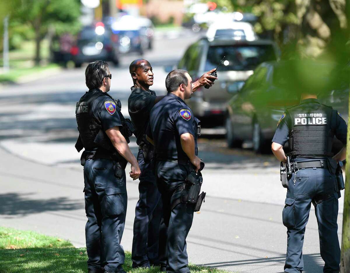 Stamford Police investigate the scene of an East Side neighborhood on Seaton Road near Courtland Avenue in Stamford, Conn. on July 9, 2019 on a report of shots fired. According to police scanner reports, two suspects were taken into custody at the scene.