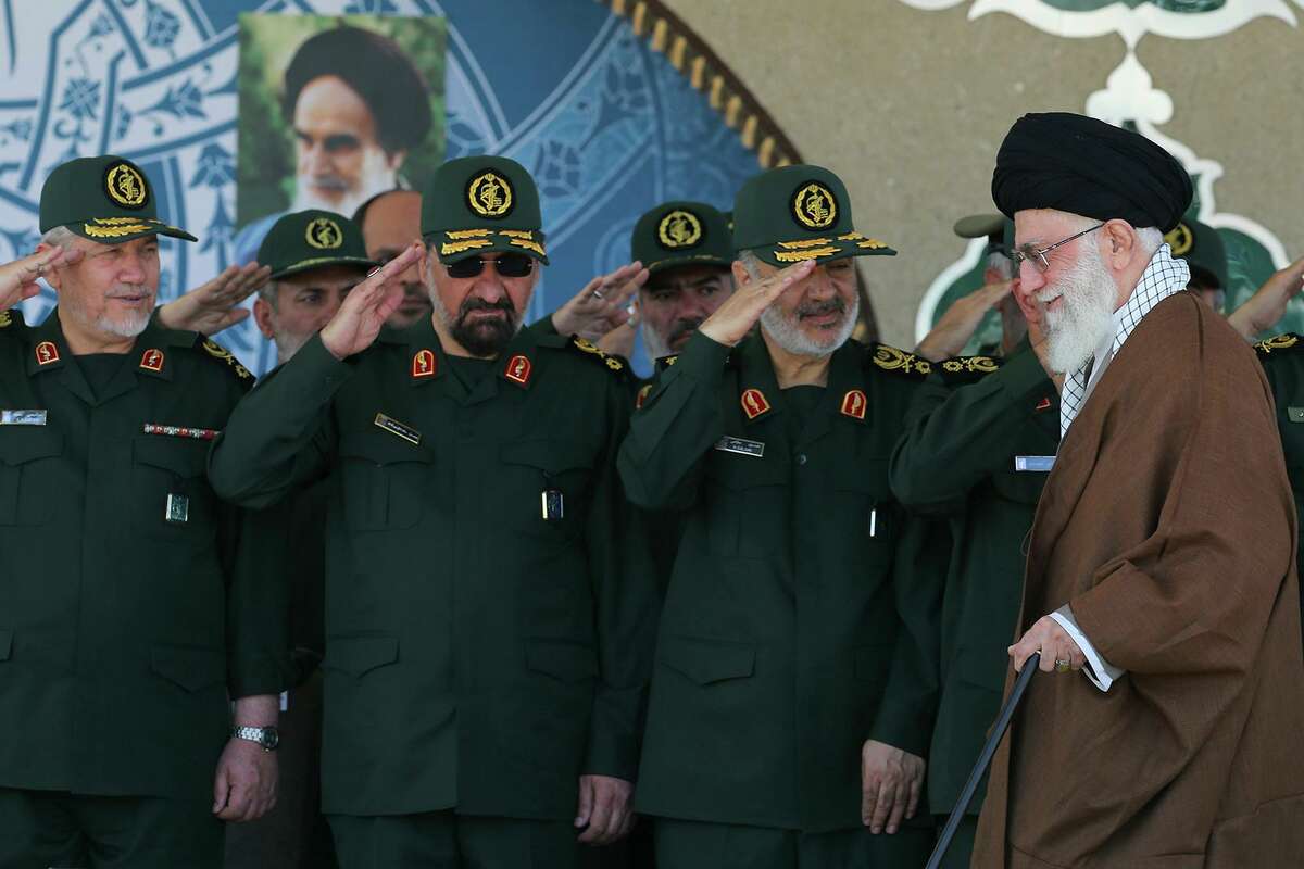 Supreme Leader Ayatollah Ali Khamenei, right, arrives at a graduation ceremony of the Revolutionary Guard's officers.