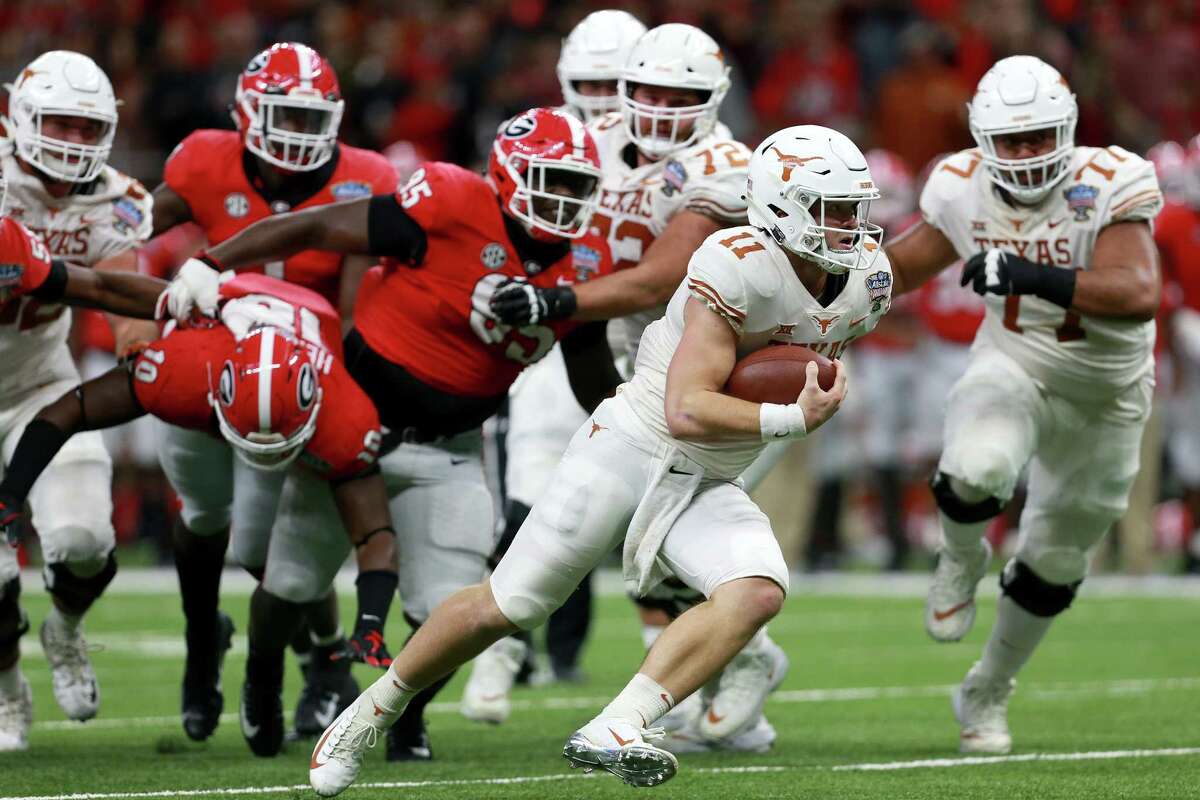 NEW ORLEANS, LOUISIANA - JANUARY 01: Sam Ehlinger #11 of the Texas Longhorns runs for a touchdown against the Georgia Bulldogs during the first half of the Allstate Sugar Bowl at the Mercedes-Benz Superdome on January 01, 2019 in New Orleans, Louisiana. (Photo by Sean Gardner/Getty Images)