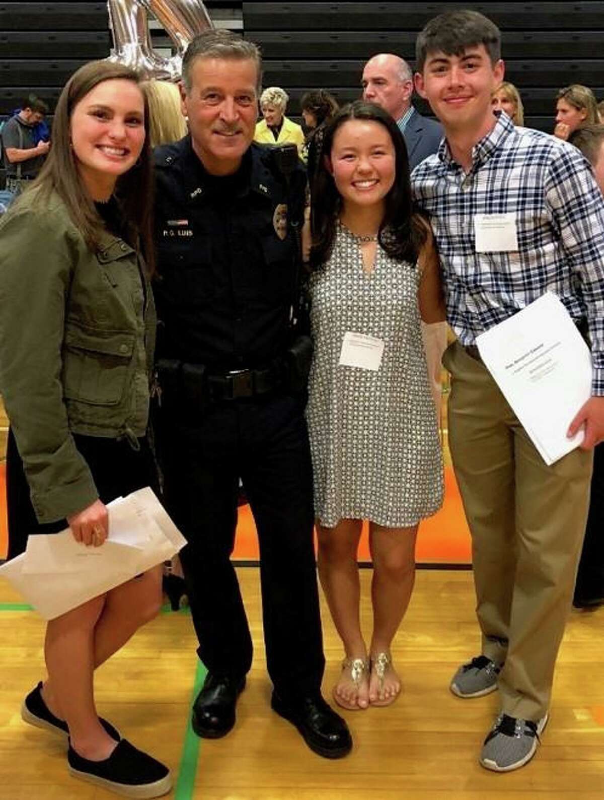 Award winners of this year’s Ridgefield Police Benevolent Association Scholarship, from left to right: Emma Brody, Officer Fernando Luis, Grace Preston and Benjamin Riek.