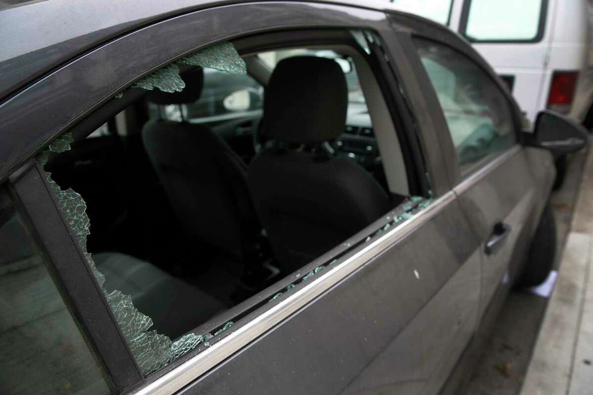 The rear window of a car is smashed.