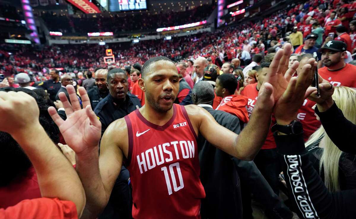 Houston Rockets guard Eric Gordon (10) is greeted by fans after the team's win over Utah Jazz in Game 5 of an NBA basketball playoff series, in Houston, Wednesday, April 24, 2019. Houston won 100-93. (AP Photo/David J. Phillip)
