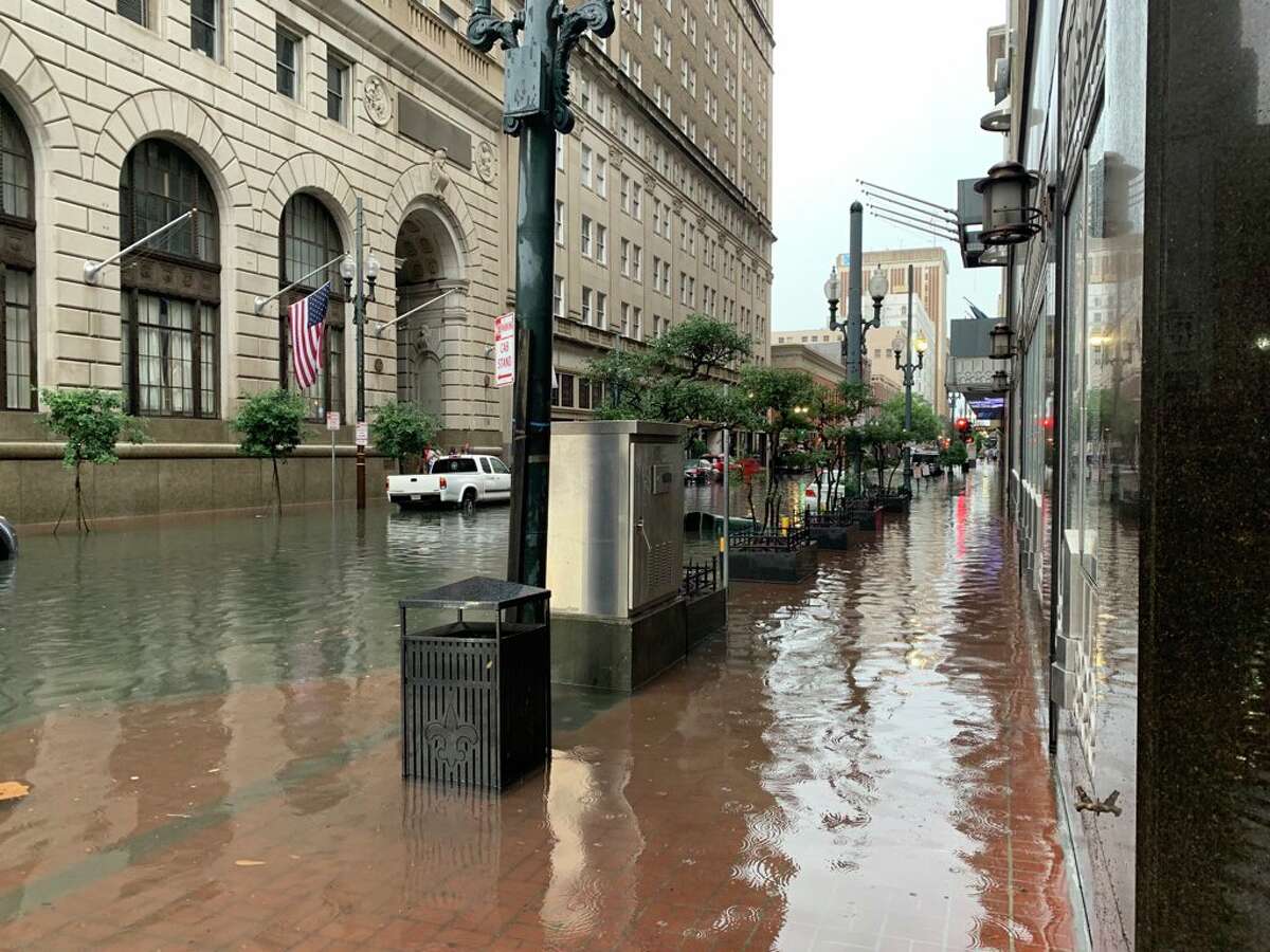 Photos show eerie scene as torrential rains flood New Orleans