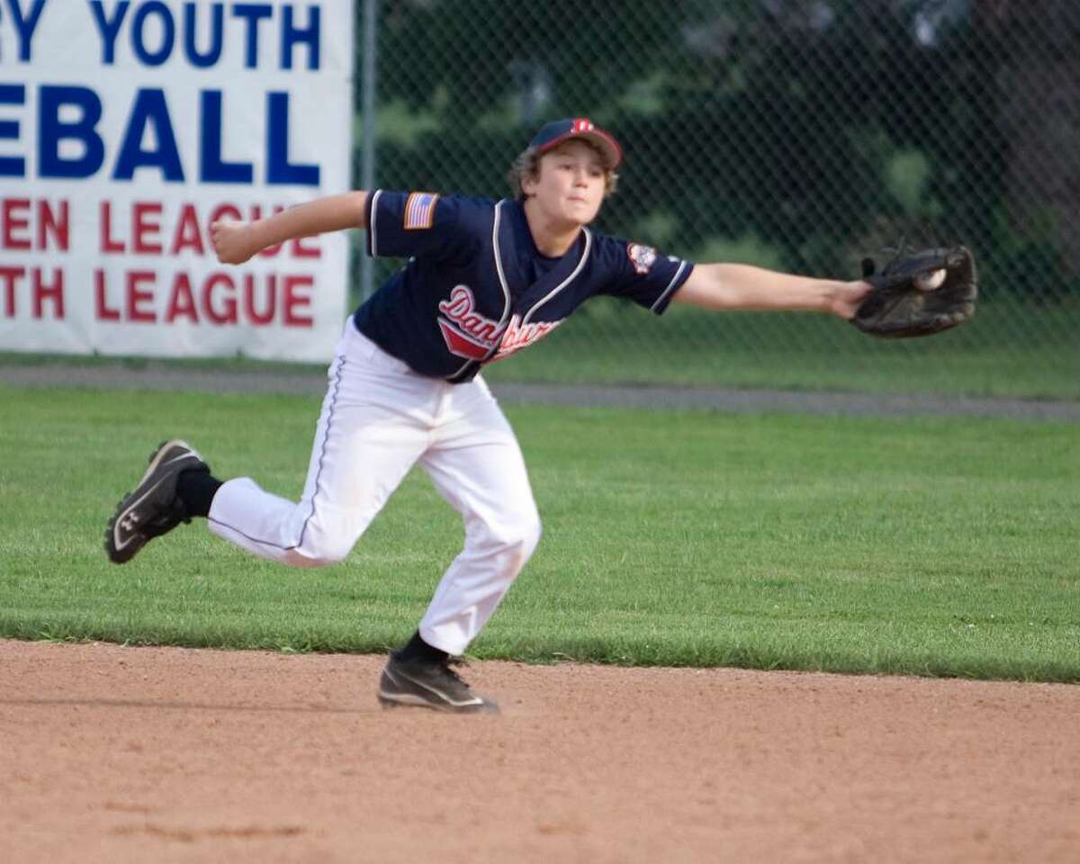 Danbury shortstop Rocco Swenson robs Southbury's Grehson Smith of a hit by grabbing his bouncer up the middle and throwing Smith out at first during the Cal Ripken state tournament 11-year-old loser's bracket championship game Friday night at Rogers Park.