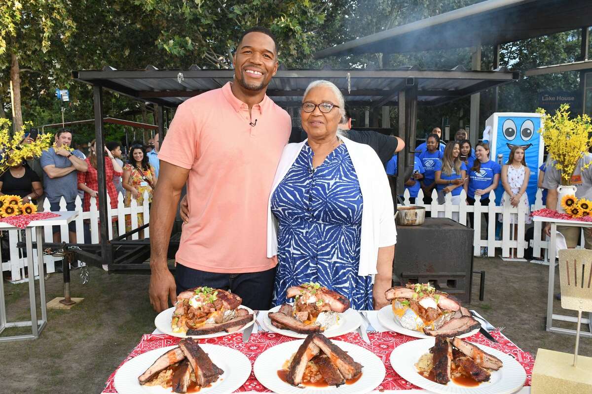 Good Morning America host Michael Strahan and his mother, Louise Strahan, in a barbecue challenge on Good Morning America in Houston.