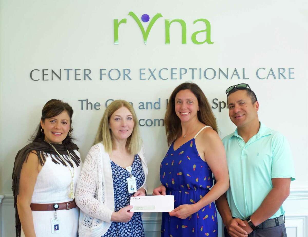 Theresa Santoro, MSN, RN, and Chris Palmer, RN, of RVNA accept the Couri Nursing Education Scholarship Gift from Megan and Chris Couri. Missing from the photo is John Apinis, RN.