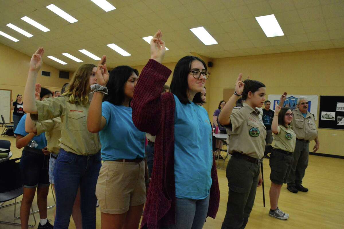 Members of Scouts BSA Troop 4640 in Pearland give the scout oath at a meeting. The group started in February after the Boy Scouts of America officially changed its name to Scouts BSA and welcomed girls as members. The troop is chartered at Pearland First United Methodist Church.