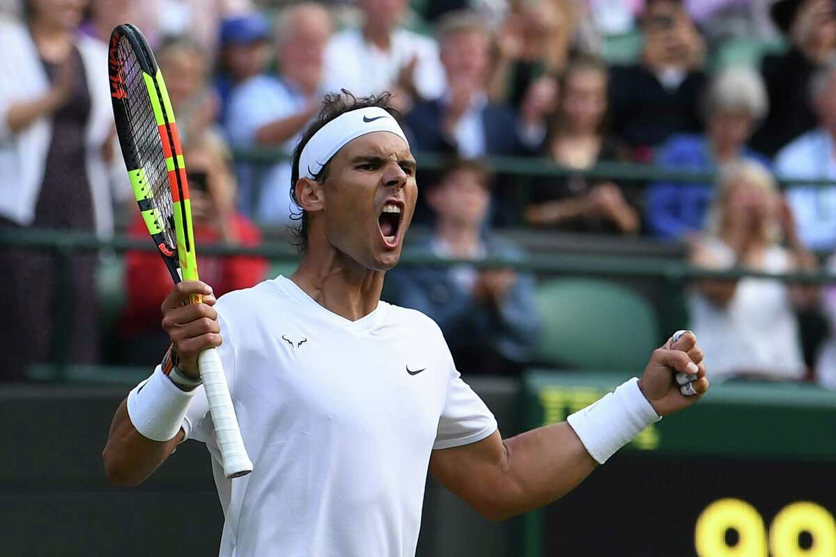 Spain's Rafael Nadal celebrates beating US player Sam Querrey during their men's singles quarter-final match on day nine of the 2019 Wimbledon Championships at The All England Lawn Tennis Club in Wimbledon, southwest London, on July 10, 2019. (Photo by Ben STANSALL / AFP) / RESTRICTED TO EDITORIAL USEBEN STANSALL/AFP/Getty Images