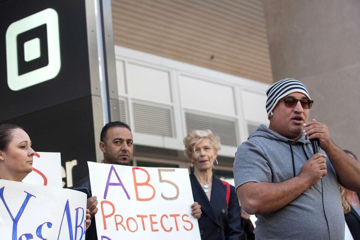 Al Aloudi, driver for 7 years, speaks alongside other Uber & Lyft drivers who gathered outside Uber HQ in support of AB5, the California legislation that would make them employees. Tuesday, June 18, 2019. San Francisco, Calif.