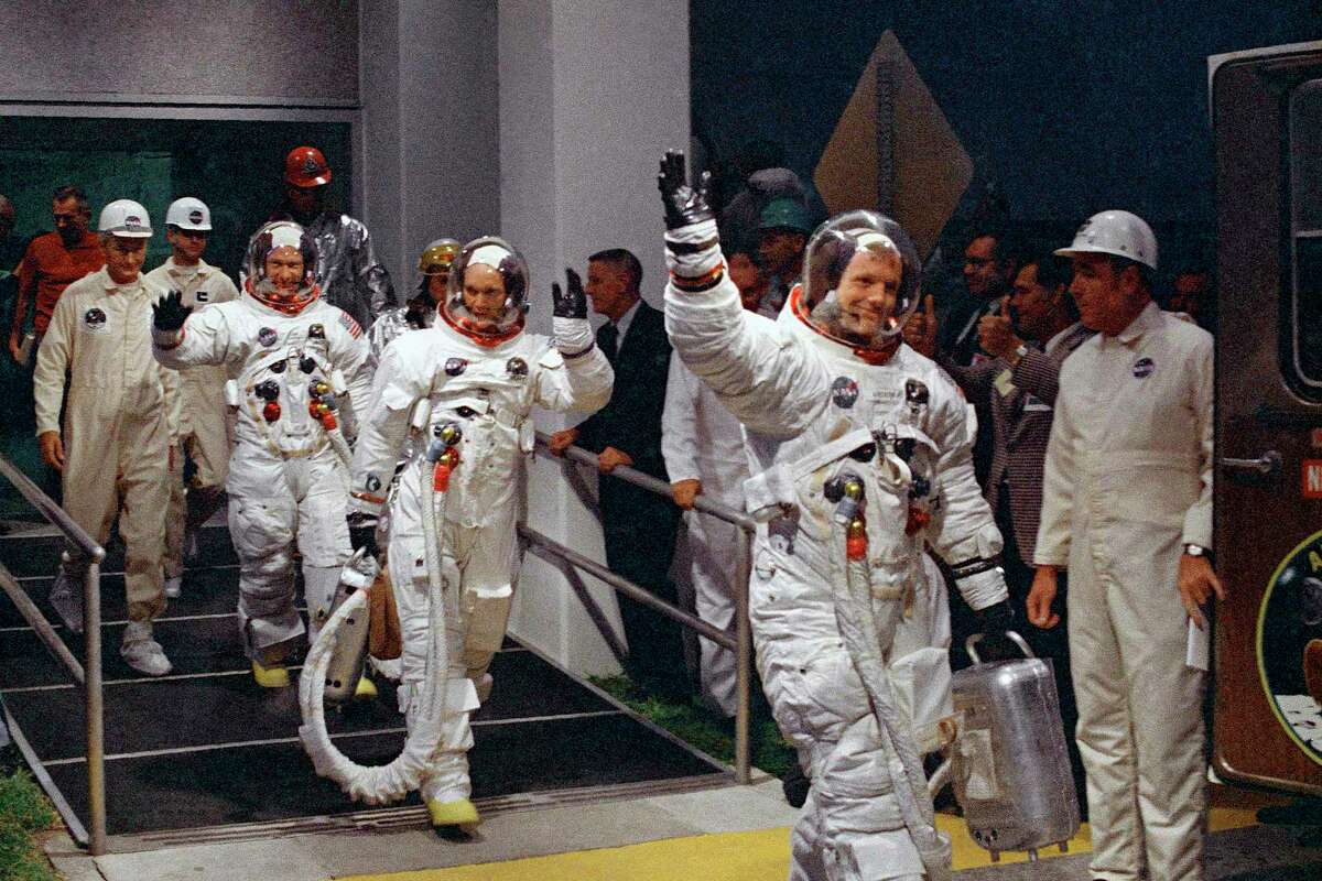 In this July 16, 1969 file photo, from right, Neil Armstrong, Michael Collins and Buzz Aldrin walk to the van that will take the crew to the launchpad at Kennedy Space Center on Merritt Island, Florida.