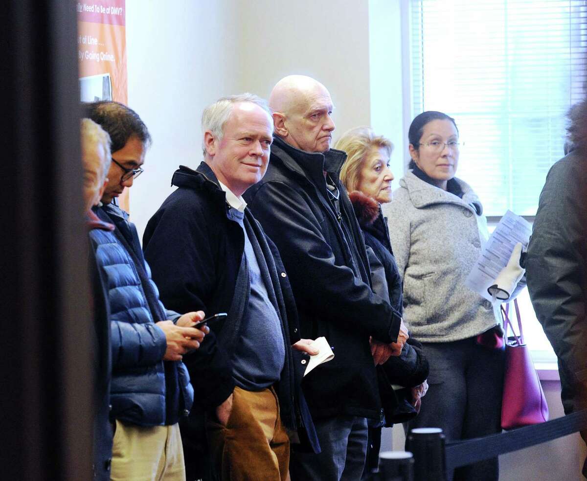 Residents of Greenwich, Conn. line up at town hall to pay their municipal taxes, in December 2017 on the heels of the passage of the Tax Cuts & Jobs Act of 2017. In its first full analysis of the 2017 tax year, the Internal Revenue Service determined that individuals with 2018 income in excess of $1 million constituted the lone bracket to pay higher taxes last year under the revised federal tax code.