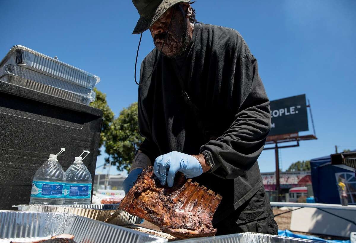 Harold Agee cooks up ribs and hot links for customers of his pop-up Big H BBQ while at the Bayview Bistro food truck park in the Bayview district of San Francisco, Calif. Wednesday, July 10, 2019.