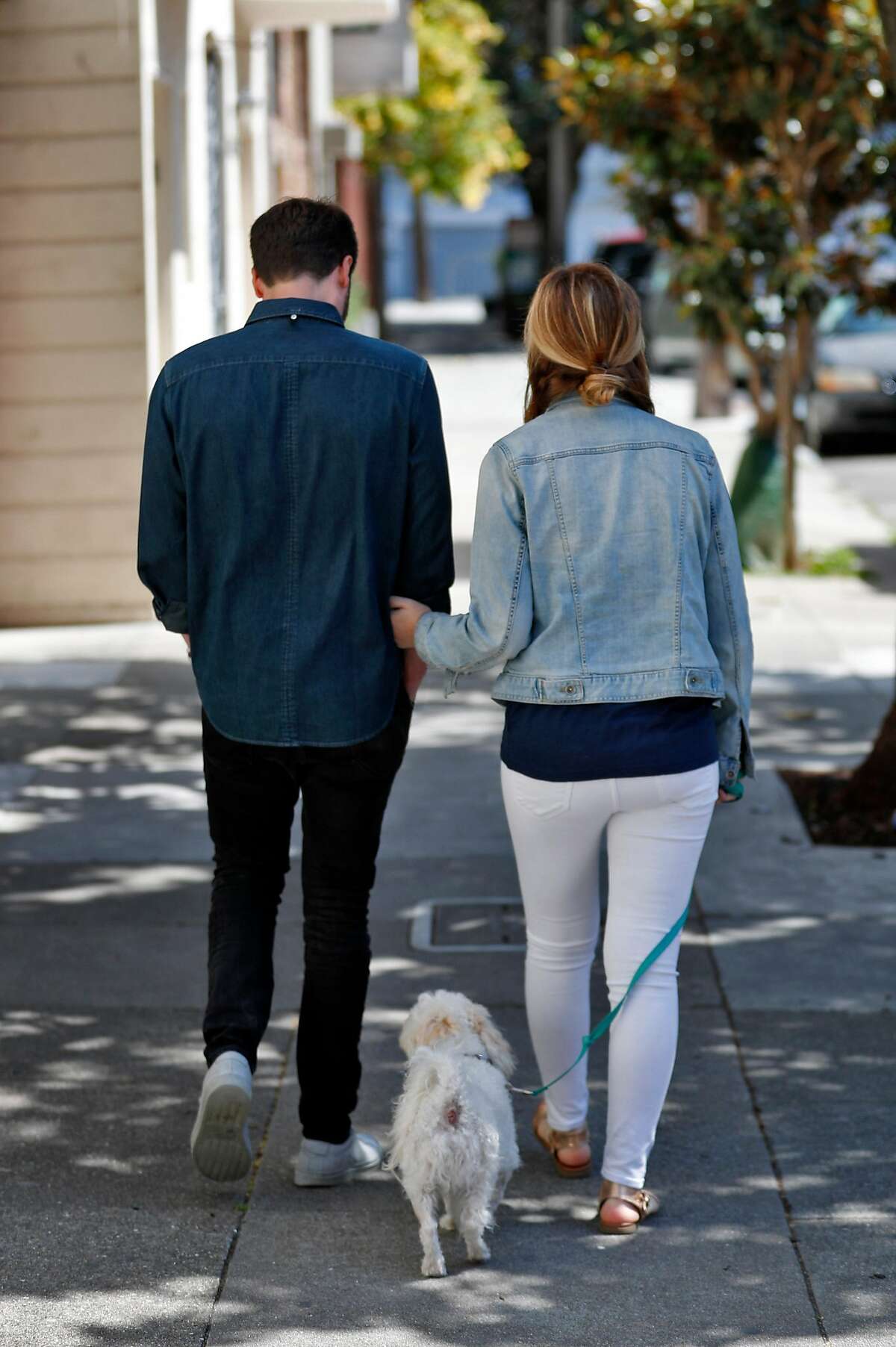 Julia and Jack Altman walk with their rescue dog Teddy near their home in the Mission District of San Francisco, Calif., on Sunday, July 7, 2019. The Altmans miscarried a baby a little over a year ago and found that reconnecting with nature and being outside to be very therapeutic. Jack felt so moved by the experience that he instituted a miscarriage leave policy at his startup, Lattice.
