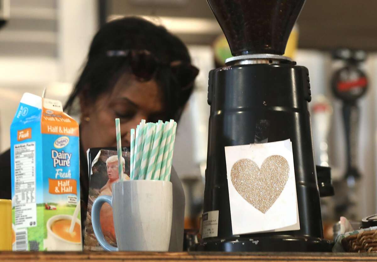 Owner Zahra Saley was just now told to only give out straws when asked and should be placed behind the counter at Cafe International on Tuesday, July 9, 2019 in San Francisco, Calif. A team from the San Francisco Dept. of the Environment go door to door to let restaurants know about the new law that started July 1, under which restaurants cannot automatically give out plastic utensils, napkins, condiment packages and other disposable items to diners, whether eat-in or take-in. They can give out the items upon request or can offer them in a self-serve area.