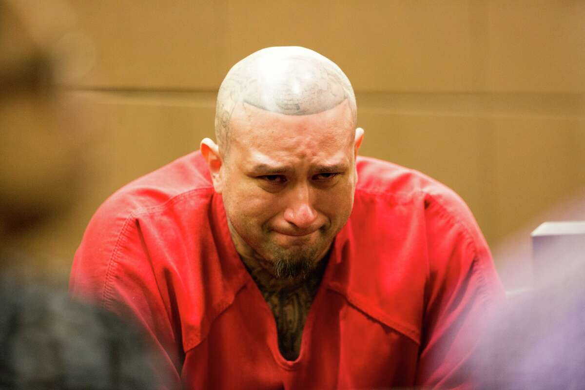 Brian Flores cries as family members say their final words to him before he appears before Judge Stephanie Boyd of 187th State District Court, Wednesday, July 10, 2019 in San Antonio. Flores is charged with Capital Murder and chose to a sentence to spend life in prison over the death penalty. Rebecca Slezak/Staff photographer