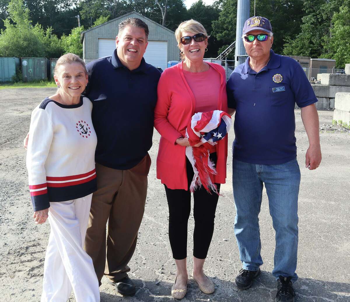 Trumbull Town Clerk Suzanne Burr Monaco with State Rep. David Rutigliano along with State Rep. Laura Devlin, and A. V. Napolitano American Legion Post 141 Commander Ernie Foito honoring Flag Day.