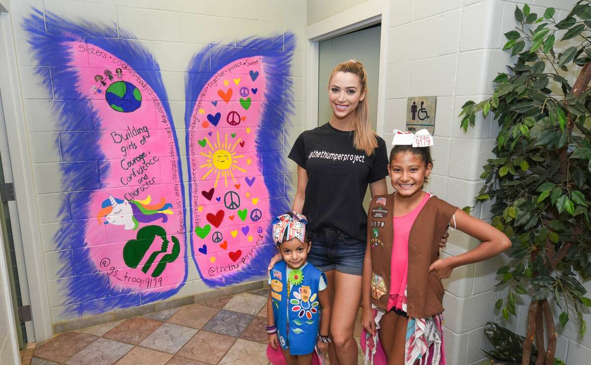 Miss Laredo Chelsea Morgensen poses for a photo with members of the Girl Scouts of South Texas Brownie Troop 9179 after completing a mural for The Thumper Project on Tuesday at the Laredo Service Center.