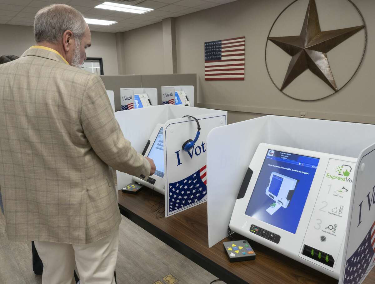 FILE PHOTO: Midland County Judge Terry Johnson tries out the new voting machines 07/11/19 at the Midland County Election Office. Midland County Attorney Russell Malm filed a petition Friday morning for permission to open ballot boxes from this election season. The petition was approved by Judge David Lindemood of the 318th District Court, and ballot boxes are set to be opened at 9 a.m. Thursday in the Commissioners’ Court located at the Midland County Annex on “A” Street.