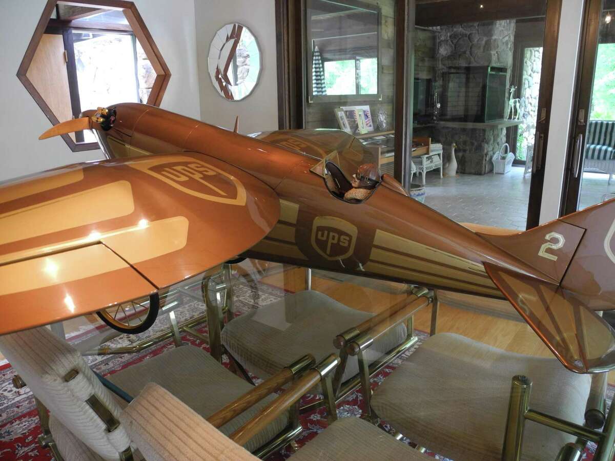 This remote-controlled airplane rests on the Stilleys’ dining room table.
