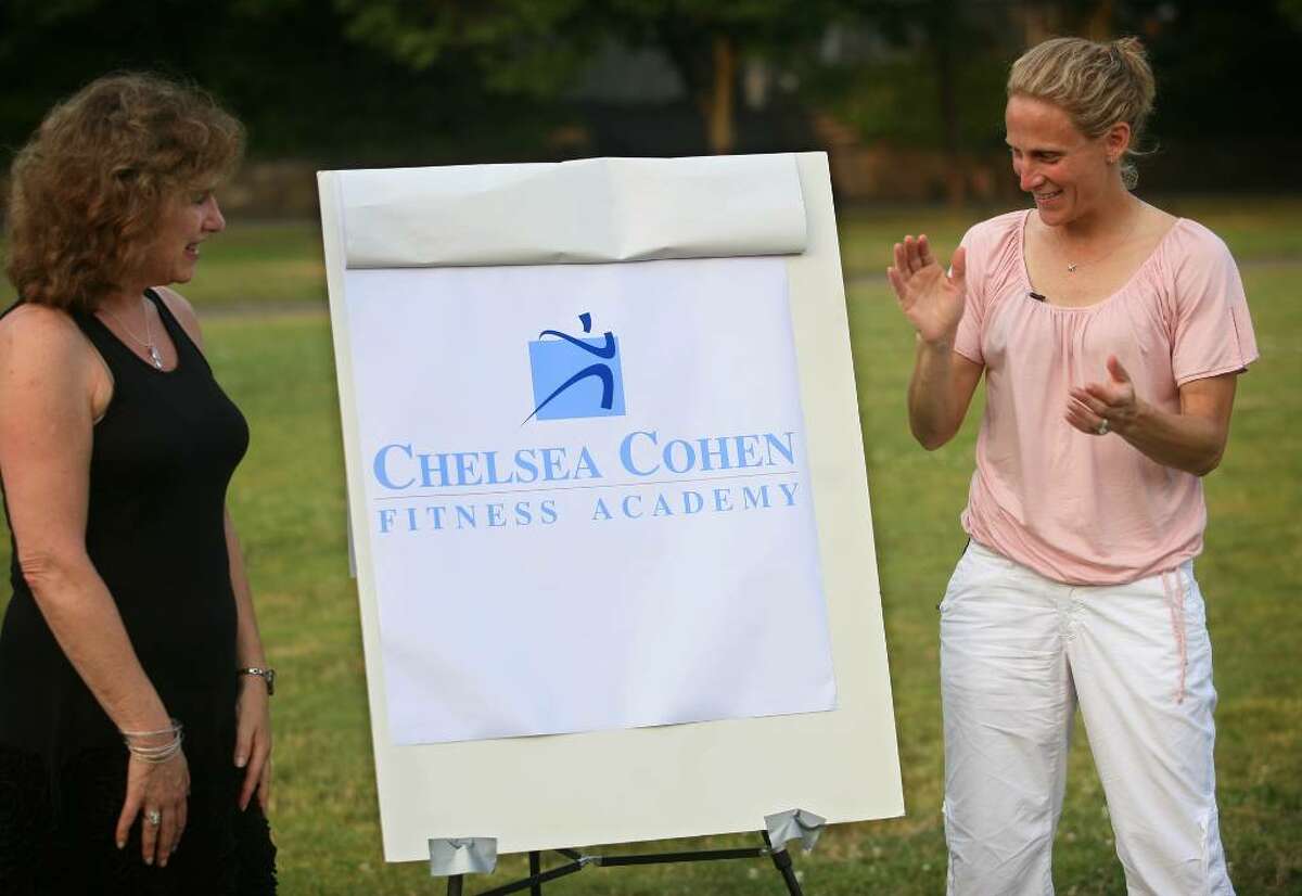 Chelsea Cohen's mom Barbara Rittner, left, and soccer star Kristine Lilly unveil the logo for the Fairfield County Sorts Commission's Chelsea Cohen Fitness Academy during a press conference outside Norwalk City hall on Sunday, June 27, 2010. The logo features the color Carolina blue, the color used by Lilly's alma mater the University of North Carolina, a school the Cohen had also wanted to attend.