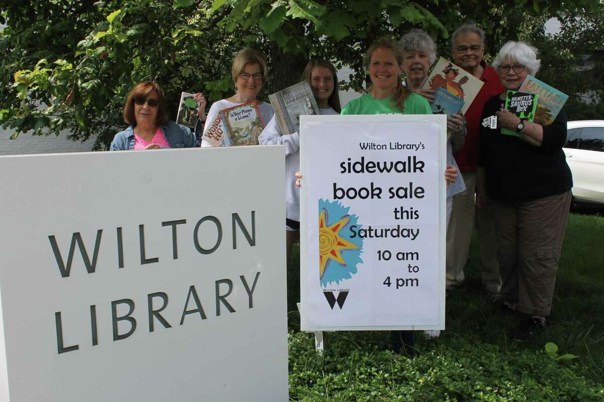 Wilton Library's book sale volunteers will have outdoor shelves stacked with items for sale at the street fair on July 20.