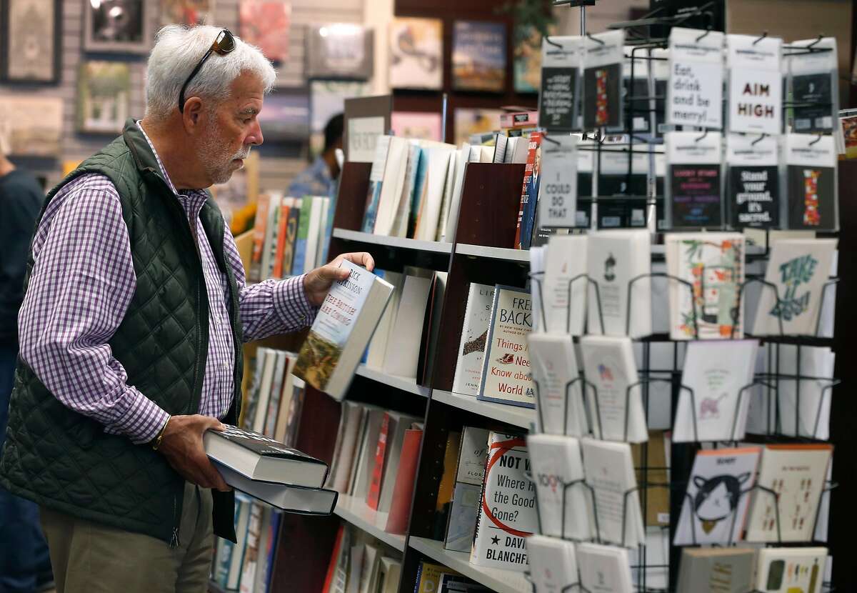 Matt Brooks shops at Books Inc., one of the more popular stores in the Laurel Village shopping district, in San Francisco, Calif. on Thursday, July 11, 2019. Several businesses along the strip on California Street have suddenly shut their doors for good.