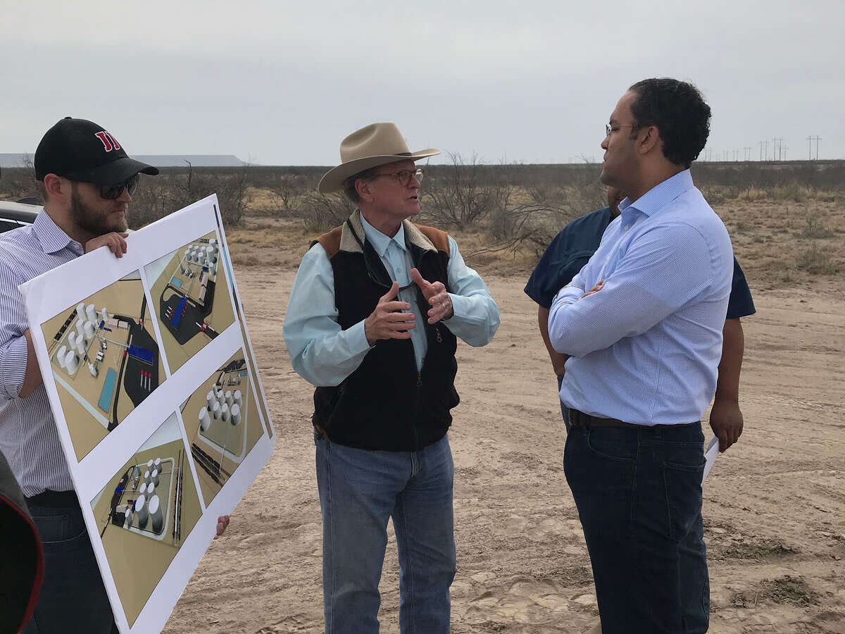 Jack Hanks, president and chief executive officer of MMEX Resources, left, discusses with Congressman Will Hurd renderings of the company’s planned crude oil refinery project near Fort Stockton. Hurd sees his time serving in the House of Representatives as a learning experience, especially about the region’s oil and gas industry.