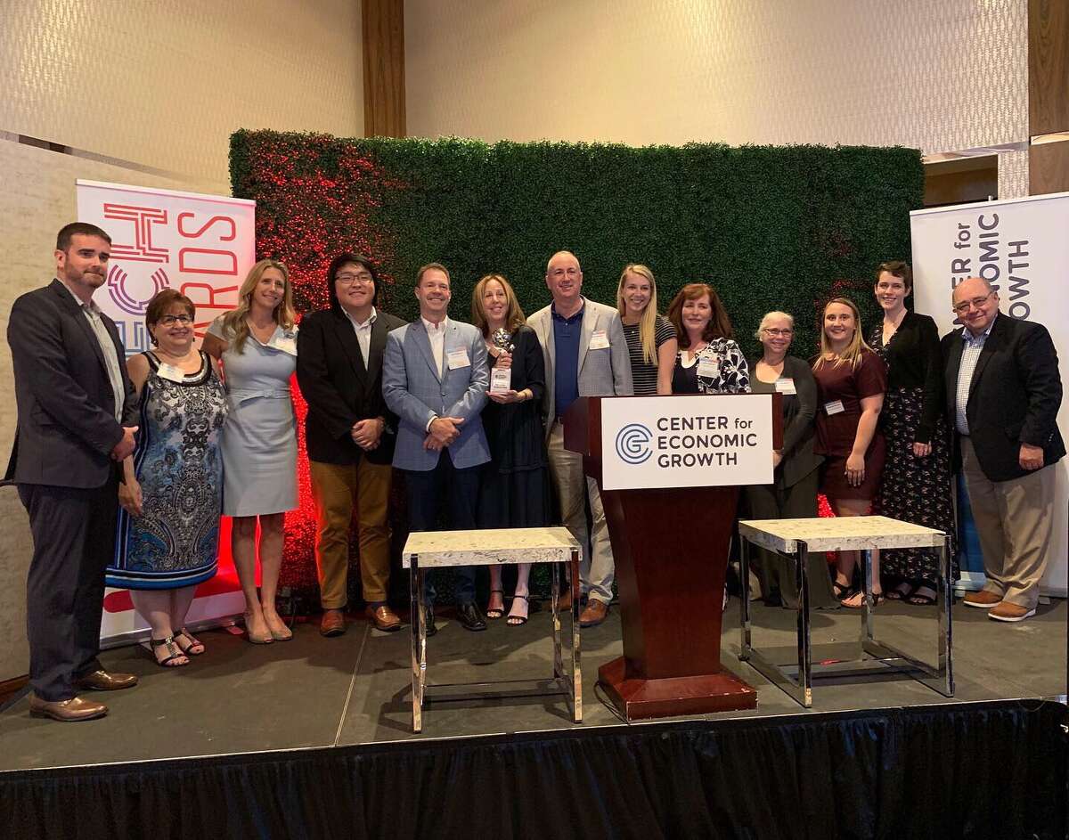 Passport for Good founder Gayle Farman (sixth from left) holds a Start-Up Star award, which her company received at the Center for Economic Growth's 23rd annual Technology Awards on June 27 at Rivers Casino in Schenectady. (Submitted photo)