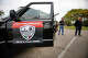 Members of Union del Barrio San Diego stand outside one of the vehicles they used to drive the streets in and around the Shelltown neighborhood on July 4, 2019. The volunteer community organization was looking for activity by Immigration and Customs Enforcement agents, documenting it, when they find it, and informing the community.